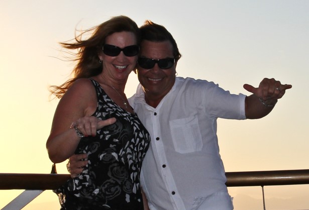 Greg and Donna - gesturing aloha in Hawaii